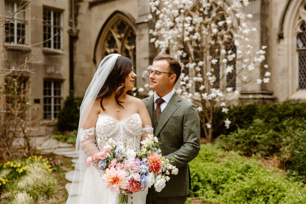 the wedding couple at the gardens at the National Cathedral