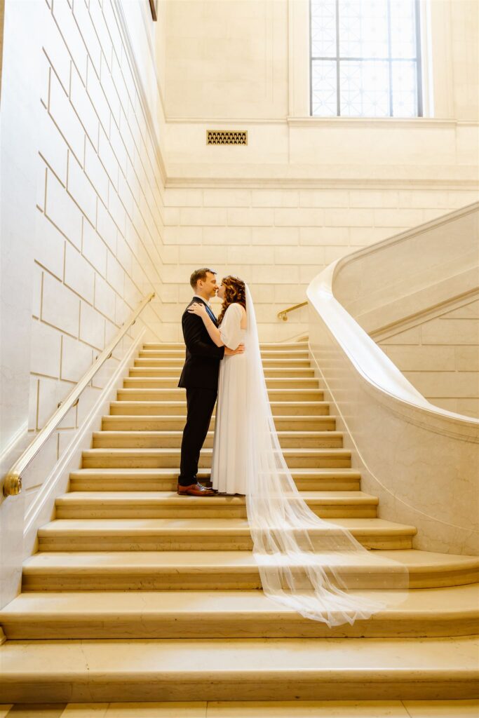 sweet elopement couple on the steps at the national gallery of art in dc
