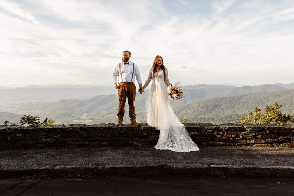 the wedding couple standing on the trail at Shenandoah National Park