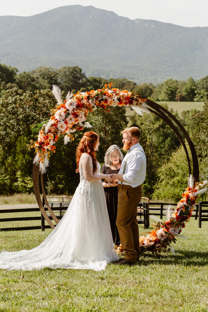 the wedding couple during their fall wedding ceremony at Shenandoah National Park