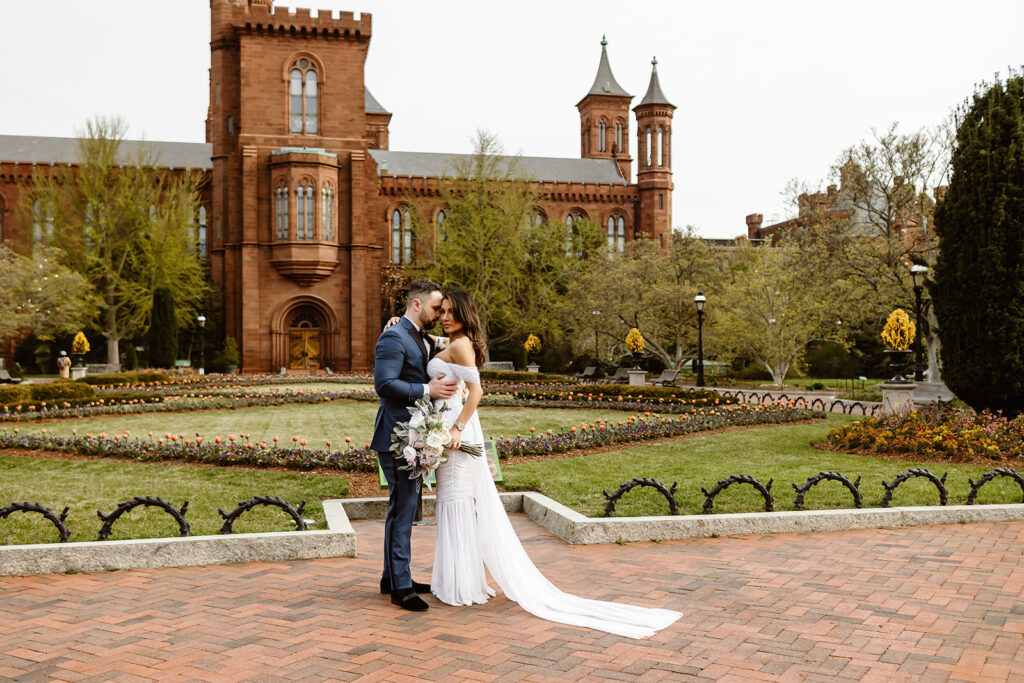 the DC wedding couple at the Smithsonian Castle for wedding photos