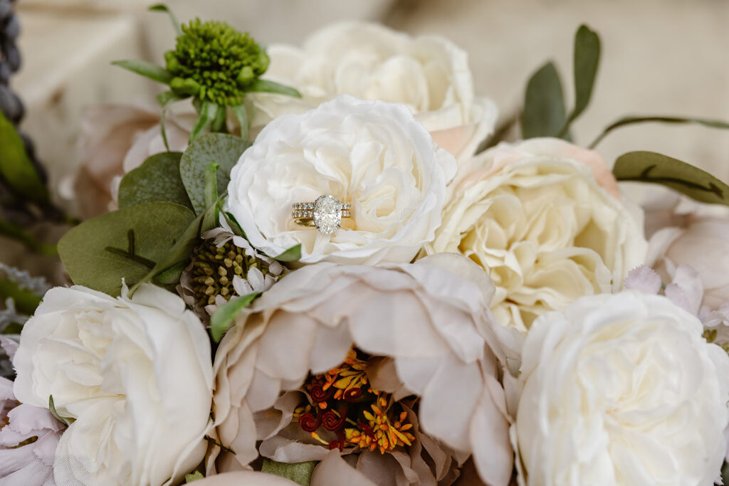 Wedding flowers with wedding ring for wedding detail photography