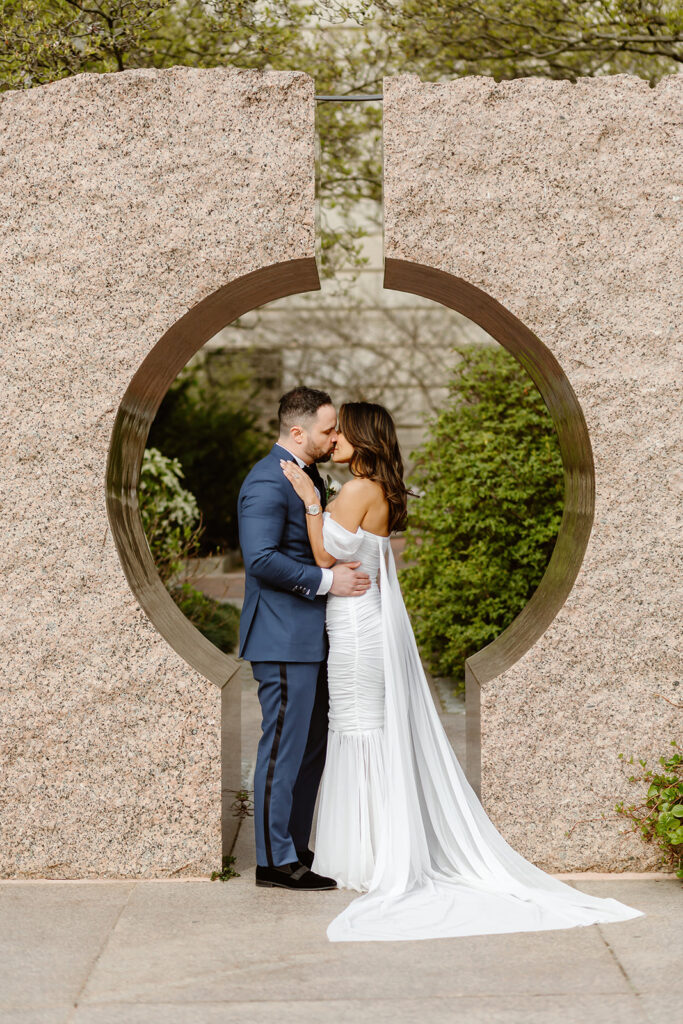 the wedding couple in the gardens at the Smithsonian Castle