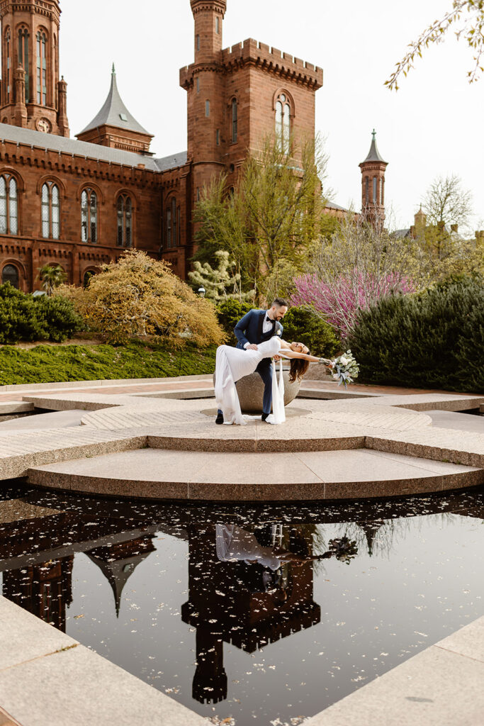 the DC elopement couple posing for elopement photography at the Smithsonian Castle