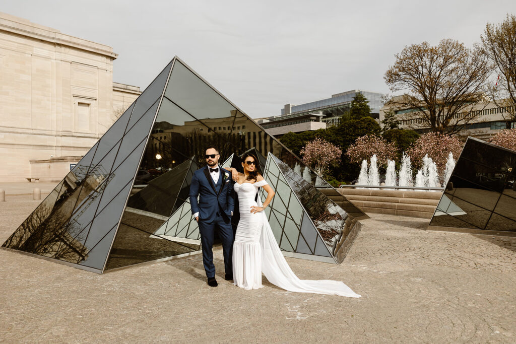 the engagement couple at the glass structure at the National Gallery of Art