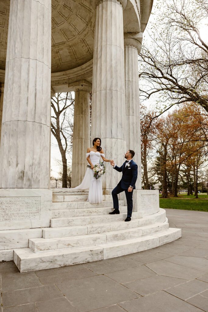 the wedding couple at the stairs for the DC War Memorial elopement photos