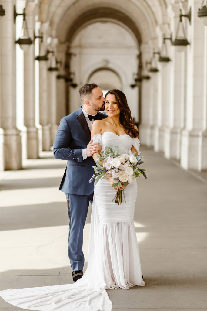 the wedding couple taking DC elopement photos at the Union Station