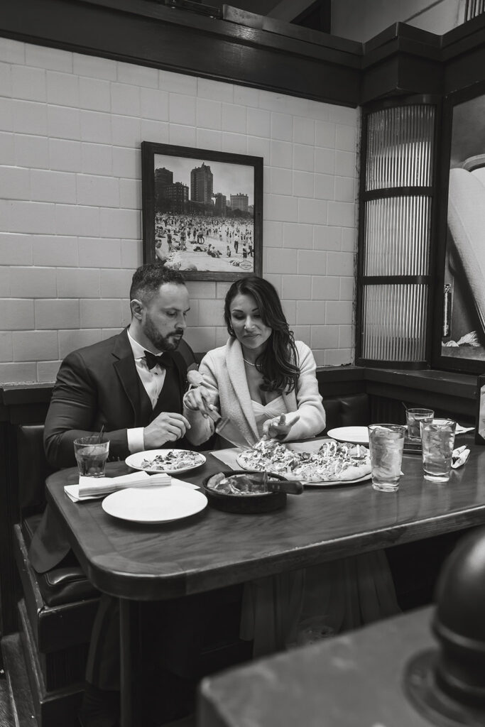 the wedding couple eating lunch at the Union Station during their DC elopement