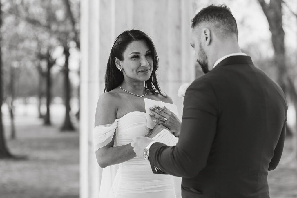 the wedding couple saying their vows at the DC War Memorial