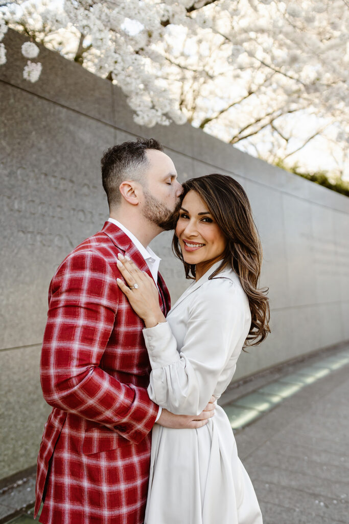 the wedding couple with the cherry blossoms in DC