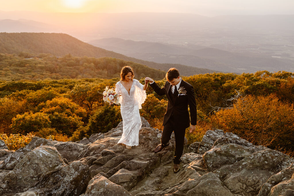 the elopement couple hiking during sunset