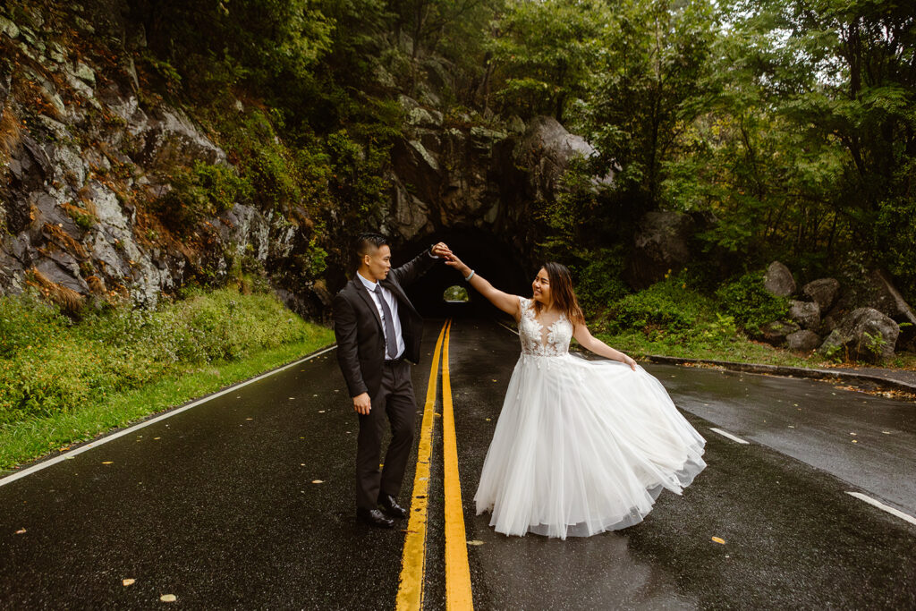 the rain covering the wedding couple as they dance in the rain during their Shenandoah National Park elopement