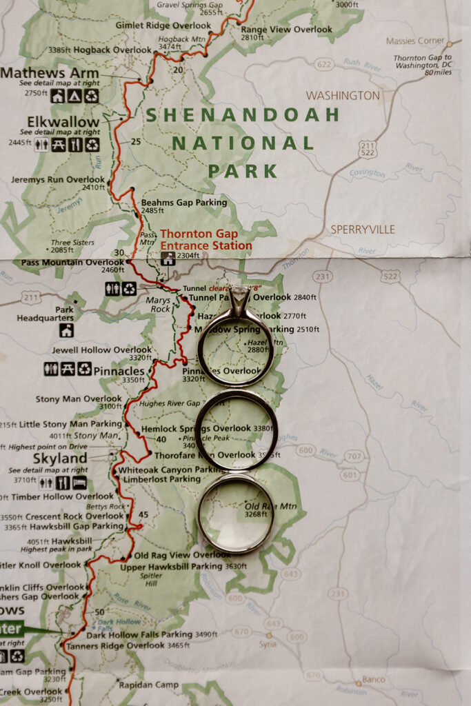 the wedding rings on top of the Shenandoah National Park map