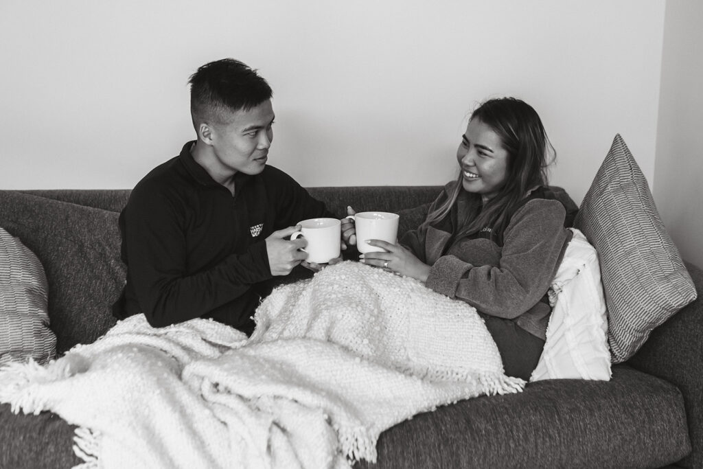 the wedding couple enjoying coffee on their couch after their rainy wedding at Shenandoah National Park