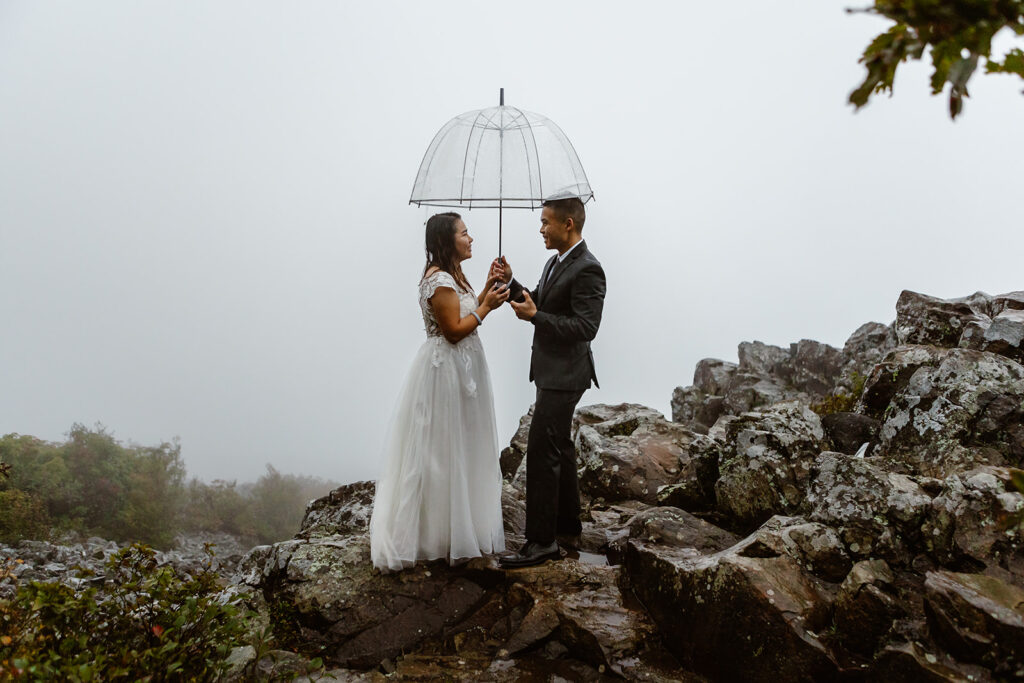 the wedding couple during their Virginia elopement in the rain 