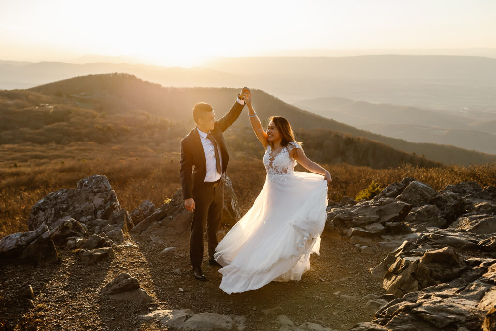 the wedding couple dancing during sunset at Shenandoah National Park