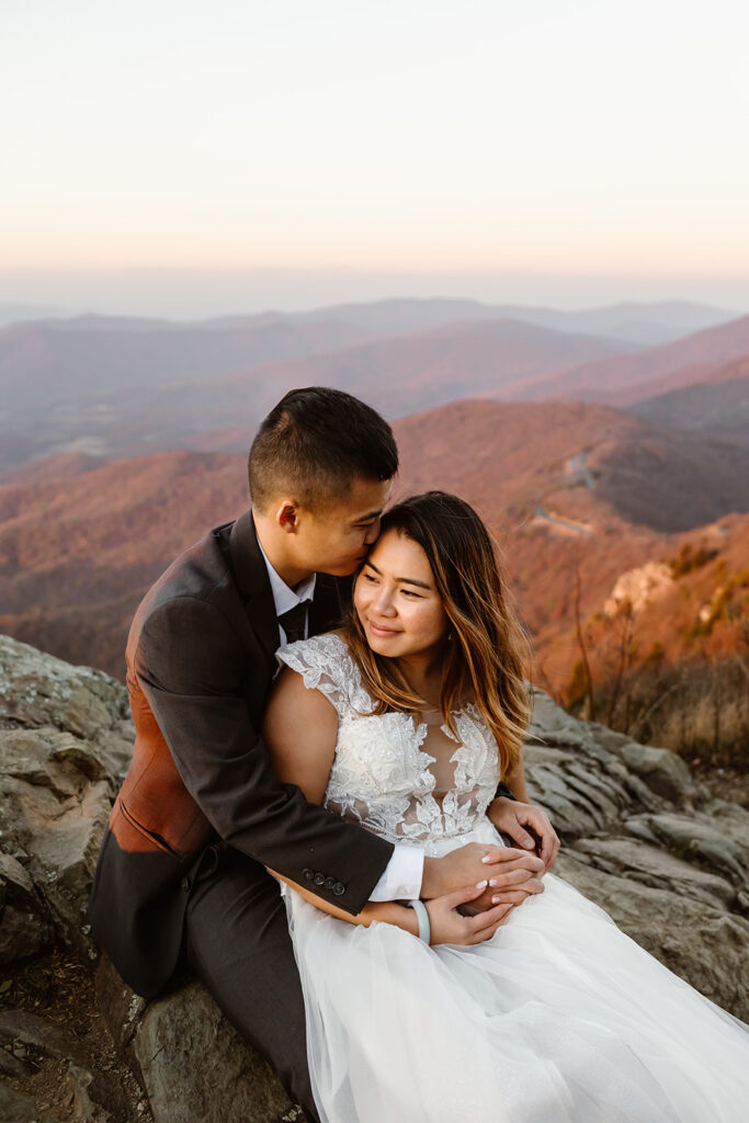 the wedding couple enjoying the sunset at Shenandoah National Park during their elopement
