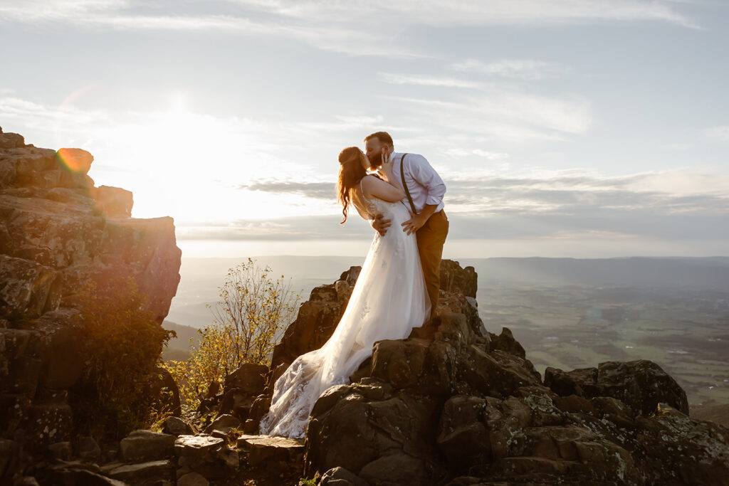 the wedding couple on the top of the mountain at Shenandoah National Park for their September elopement