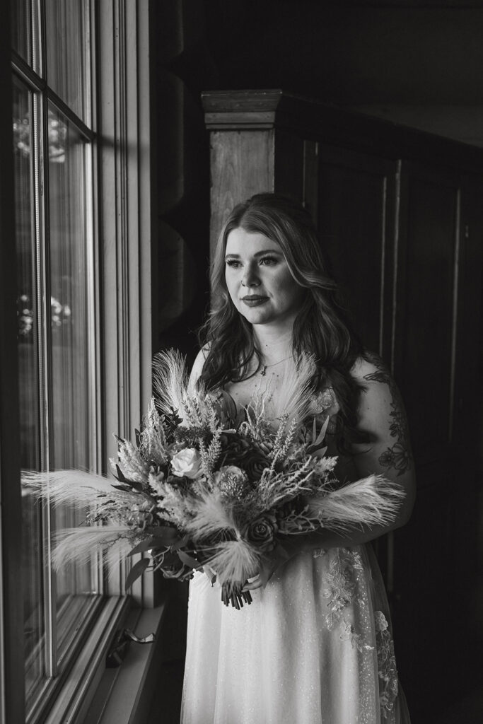 black and white wedding photo of the bride getting ready for her all elopement in Virginia