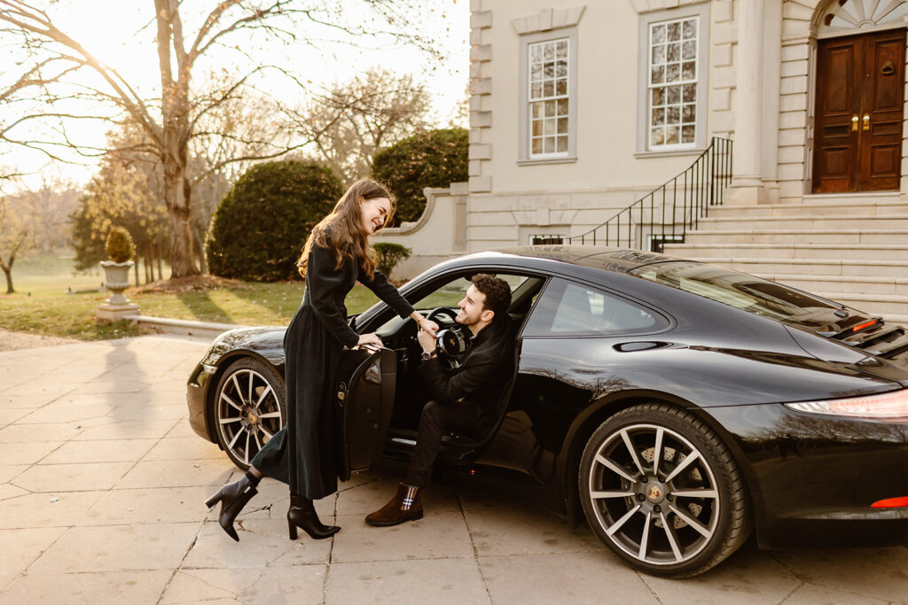 the engaged couple posing with their car for creative engagement couple photos