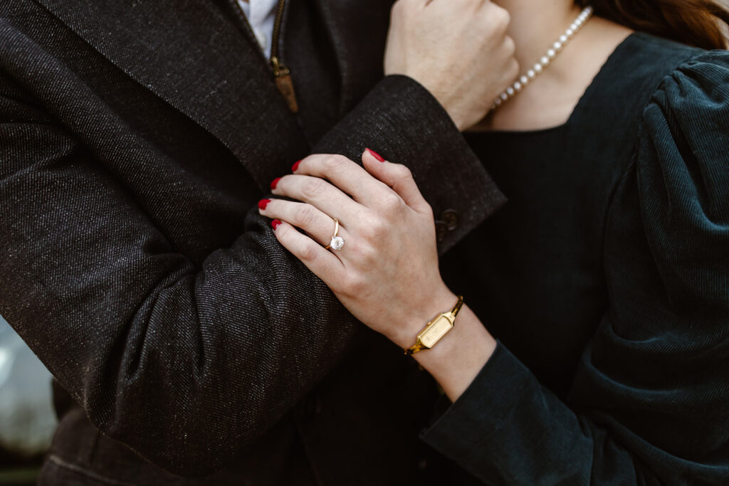 the engaged couple with their engagement ring