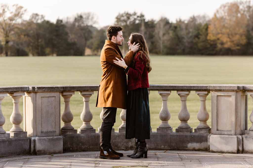 the engaged couple smiling at one another after their surprise proposal at the Great Marsh Estate