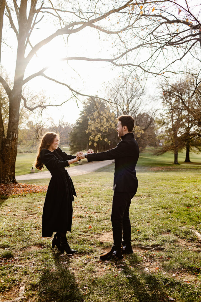 the couple dancing in the golden hour light