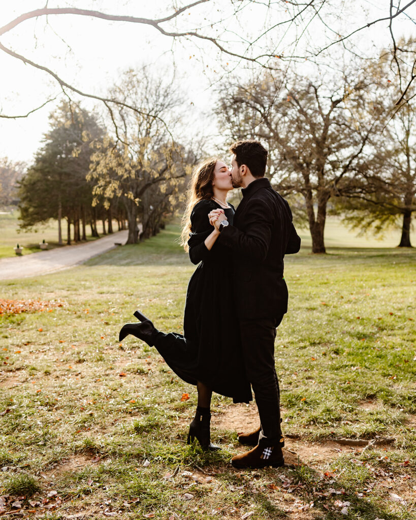 the engaged couple dancing together in the golden light