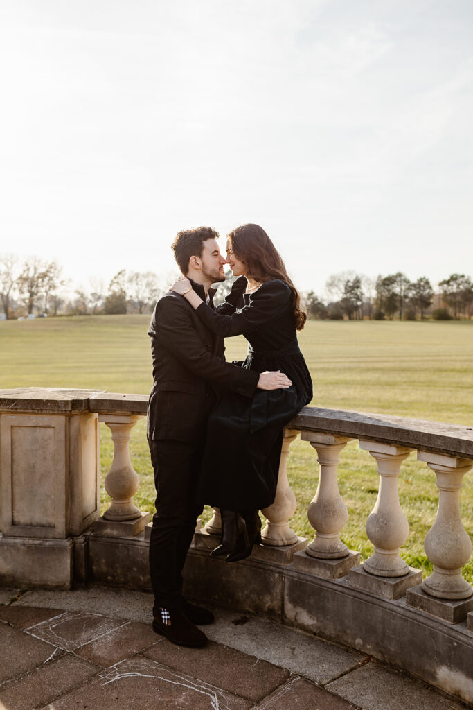 the engaged couple leaning in for a kiss at their engagement venue