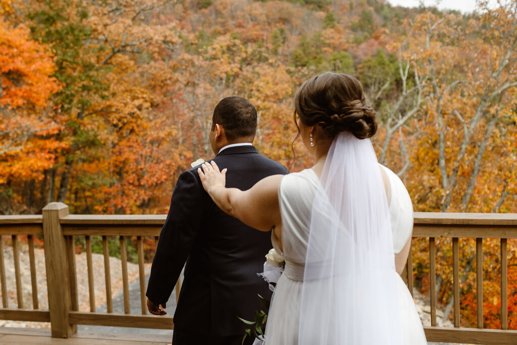 the bride tapping on the groom for their first look