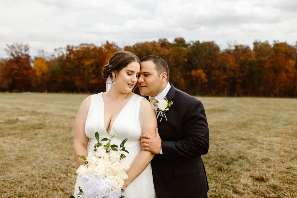 the wedding couple with fall colors in Virginia