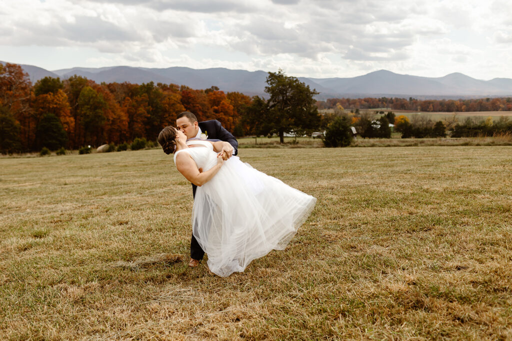 the wedding couple posing with a dip at their elopement