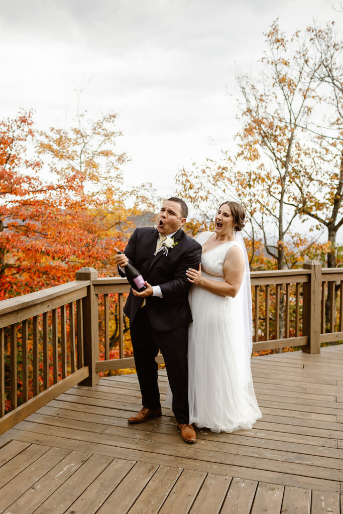 the wedding couple popping bottles of champagne 