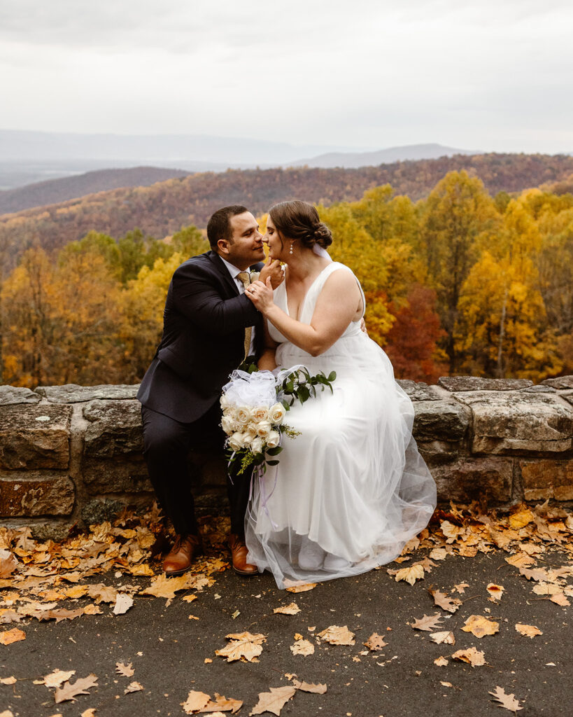 the wedding couple taking elopement photos at Shenandoah National Park