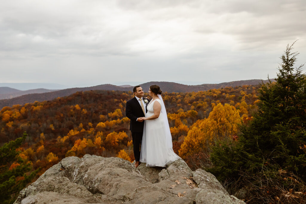 the wedding couple in the fall at Shenandoah National Park