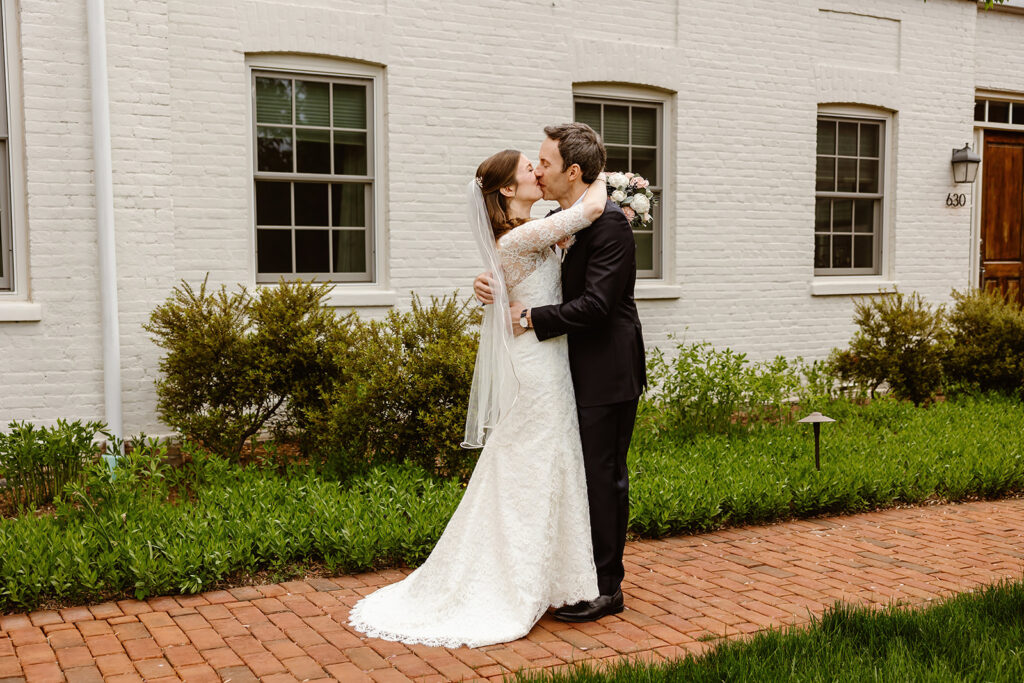 the wedding couple kissing at their first look in Washington DC