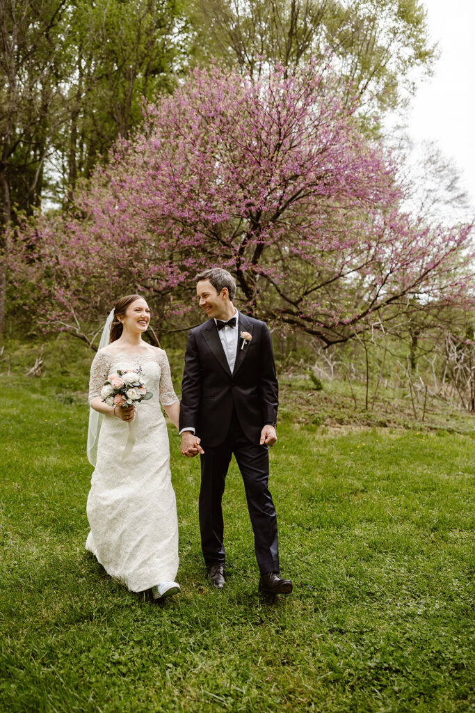 the wedding couple walking together through the park in Washington DC