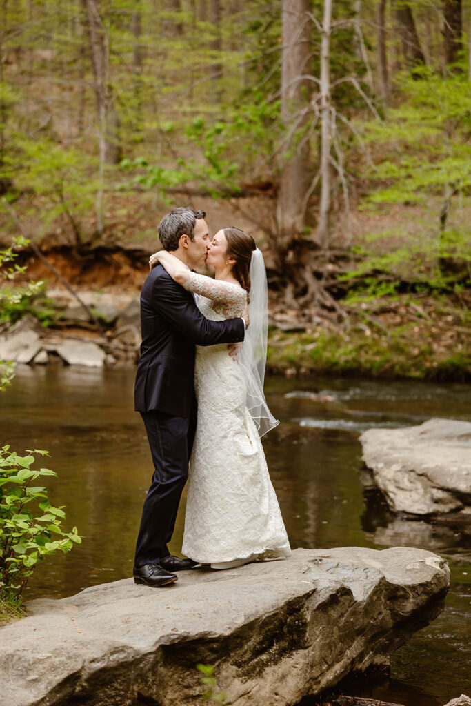 the wedding couple kissing after their private vows