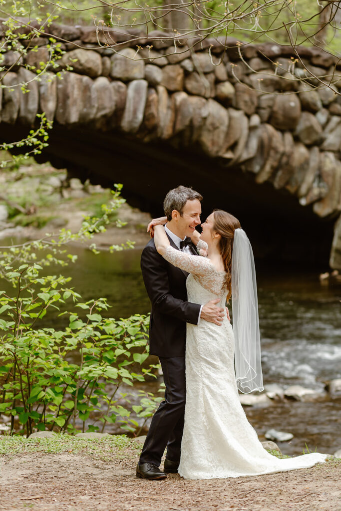 the wedding couple by the bridge in the park in Washington DC