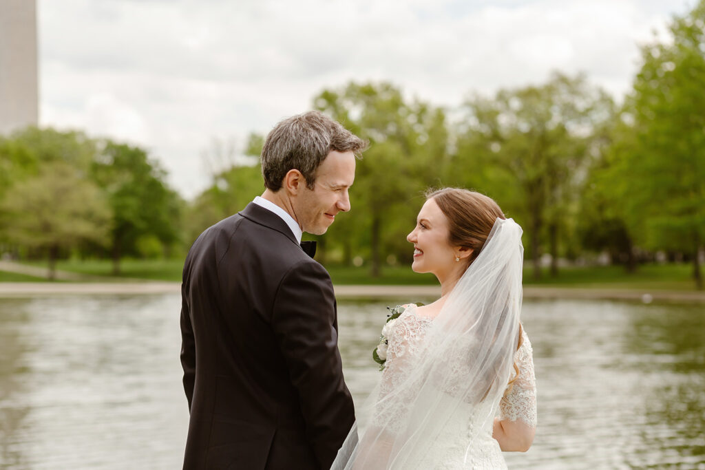 the wedding couple smiling at each other after their elopement ceremony