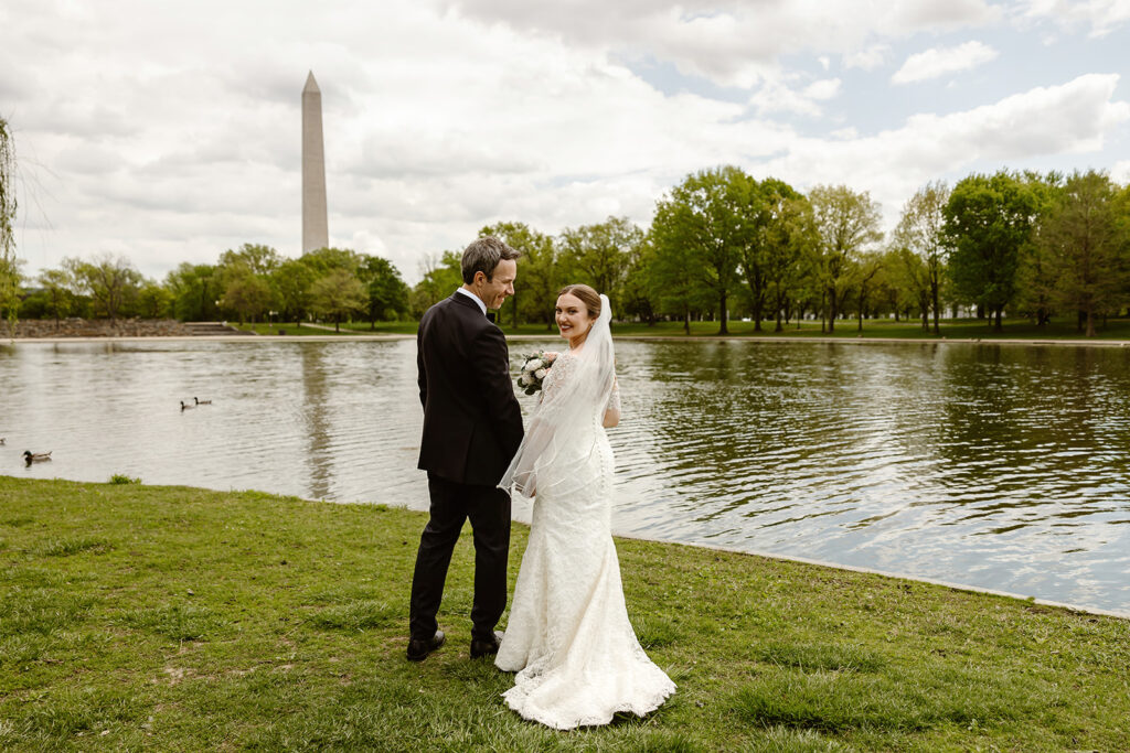 the wedding couple by the Washington Monument for DC elopement photos