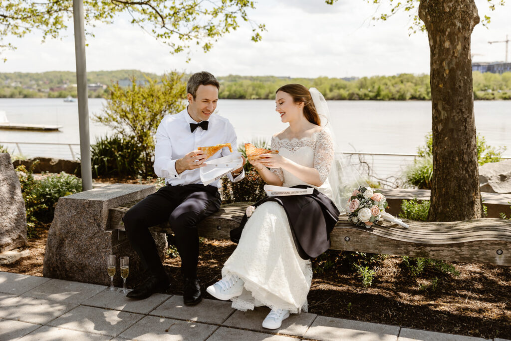 the wedding couple celebrating their DC elopement with pizza