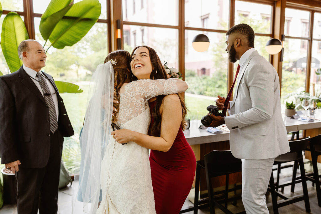 the bride hugging one of her guests