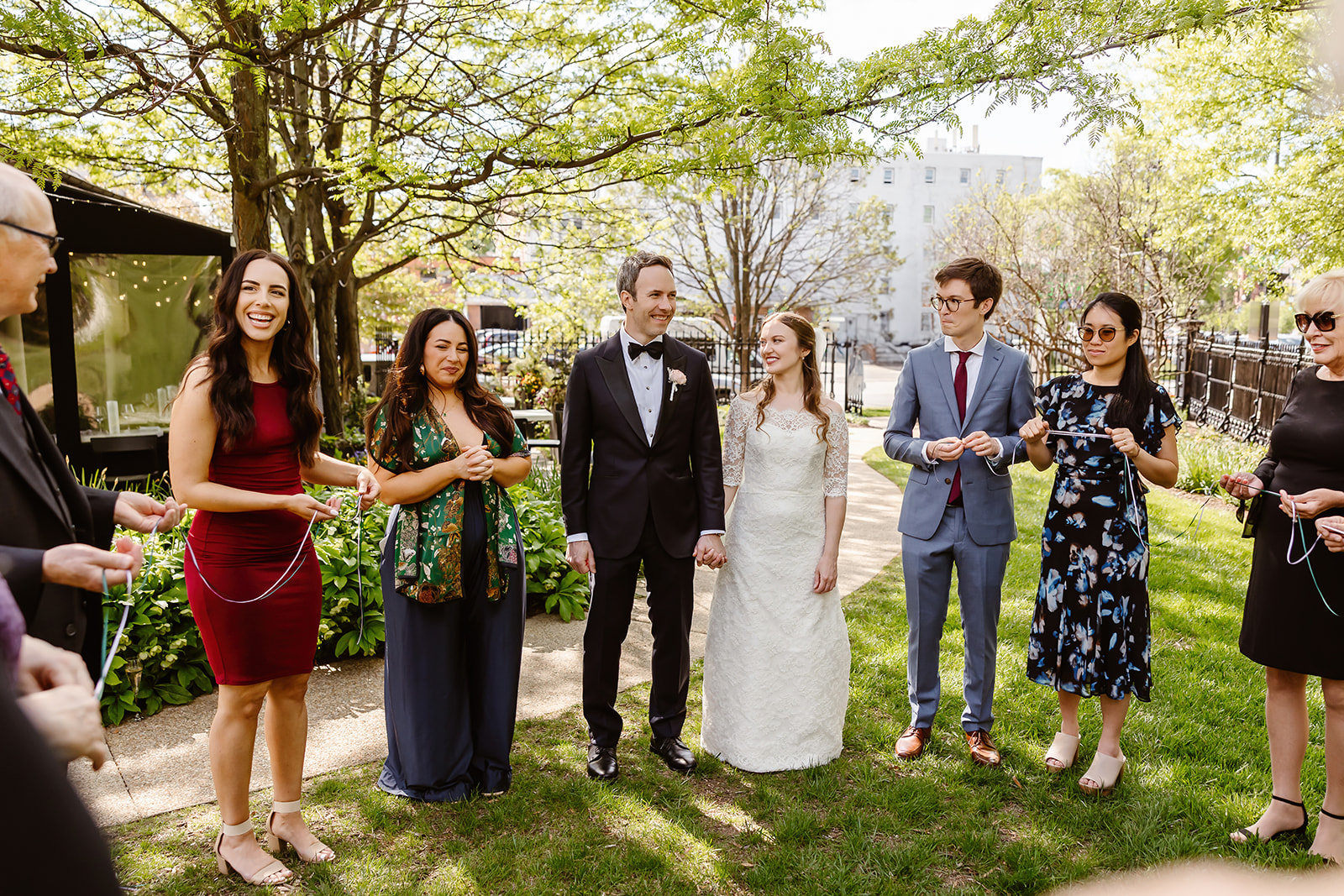 the wedding guests talking with the wedding couple