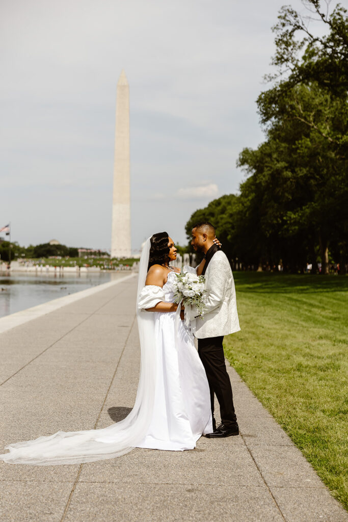 the wedding couple at the Reflection Pool for elopement photos in DC