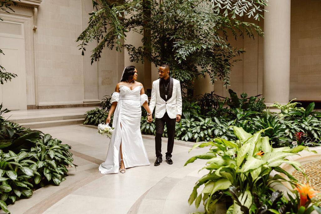 the wedding couple walking together at the National Gallery of Art