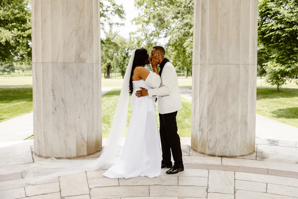 the wedding couple kissing after their elopement ceremony at the DC War Memorial