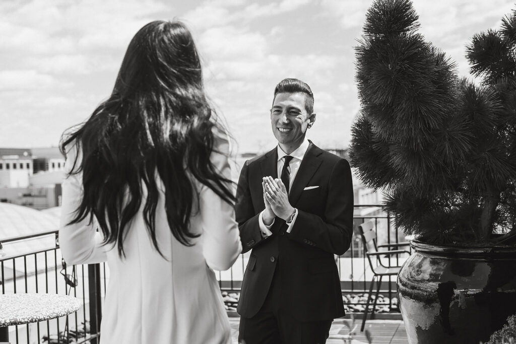 the bride and groom on the rooftop of the hotel in Washington DC for their first look