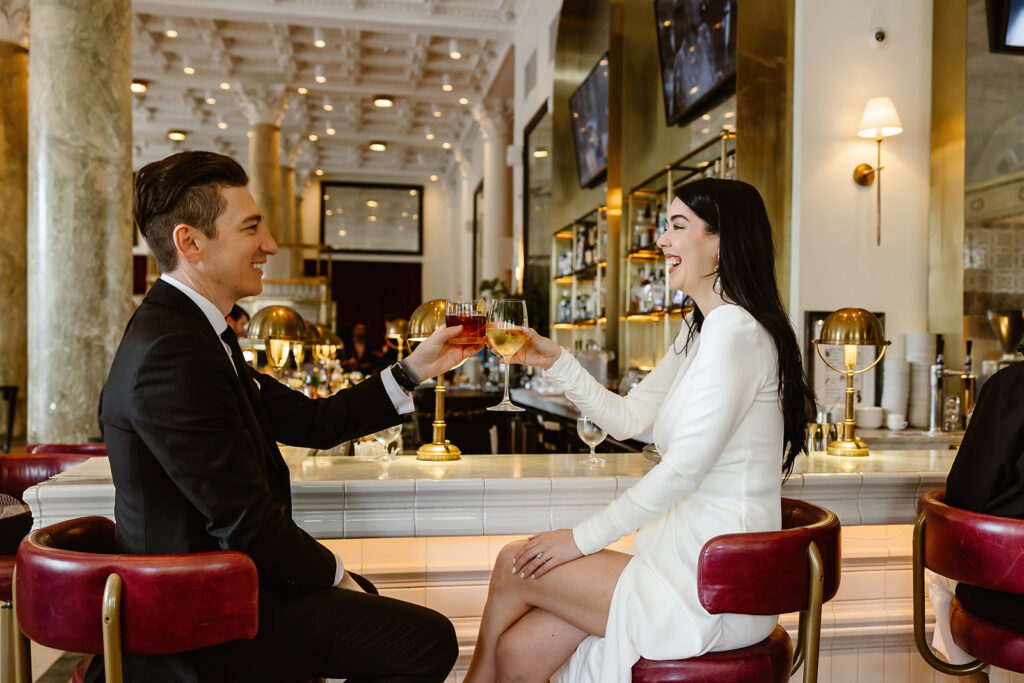 the bride and groom grabbing drinks before their elopement ceremony at the Spanish Steps