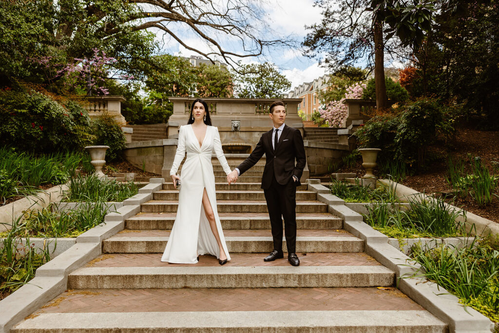 the wedding couple posing on the Spanish Steps during their DC elopement